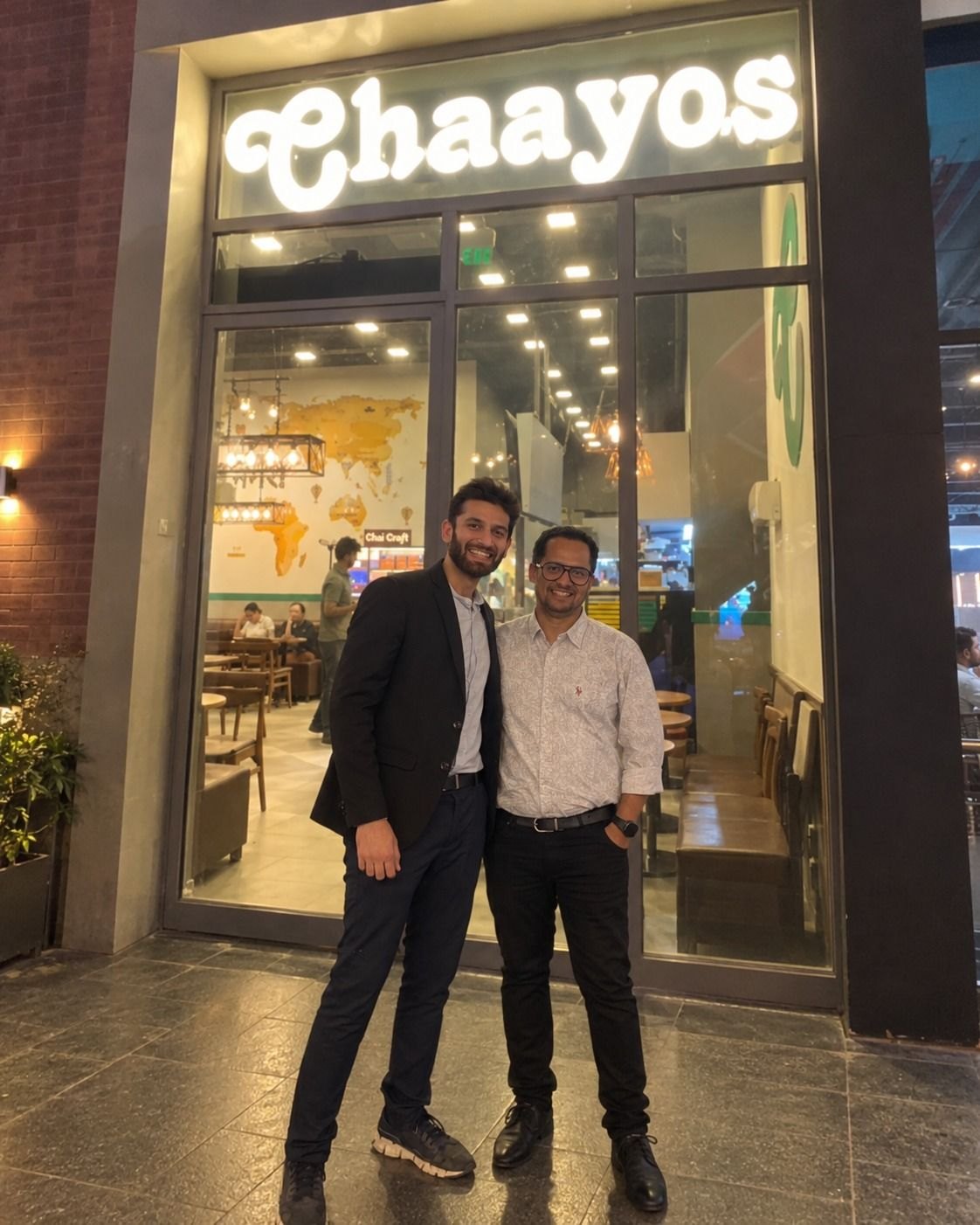 Anshul from Nodomo with Mohit Malik, CTO of Chaayos, outside a Chaayos cafe